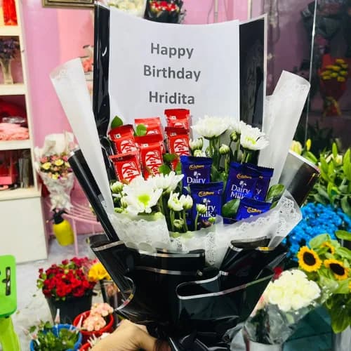 Black Wrapped Birthday Bouquet with KitKat, Dairy Milk & White Chrysanthemums