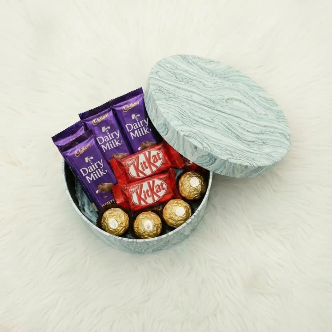Mixed Chocolate Collection in Elegant MarbleTextured Round Gift Box